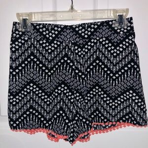 Black and White Flowy Shorts with Orange Detail